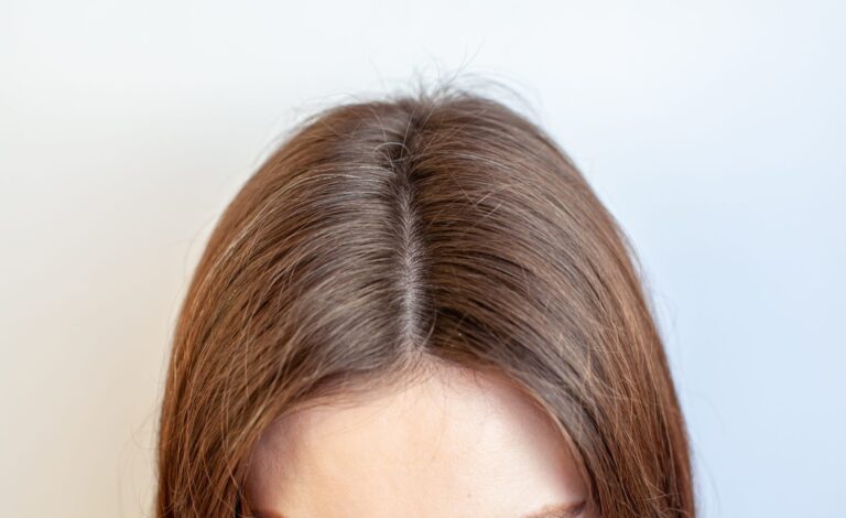 Full hair along a natural part line